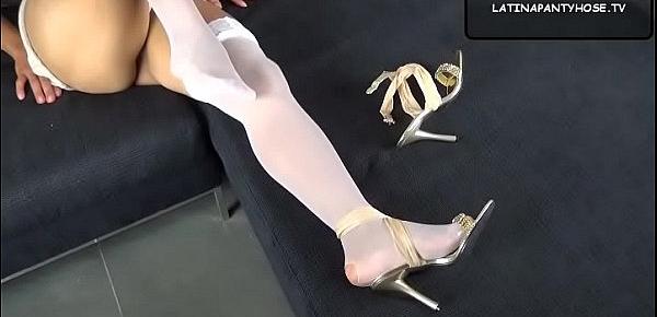  Wearing a pair of white nylon stockings and sexy sandals playing with my shoes, feet and legs